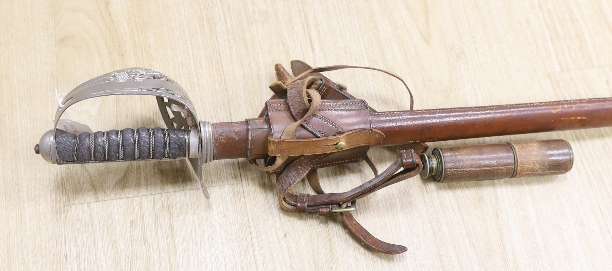 A Victorian officer’s dress sword, Wilkinson blade, together with a telescope, sword, 102cm in length